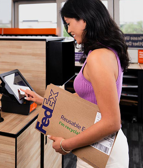 Customer handing documents to FedEx using a pre-paid QR code